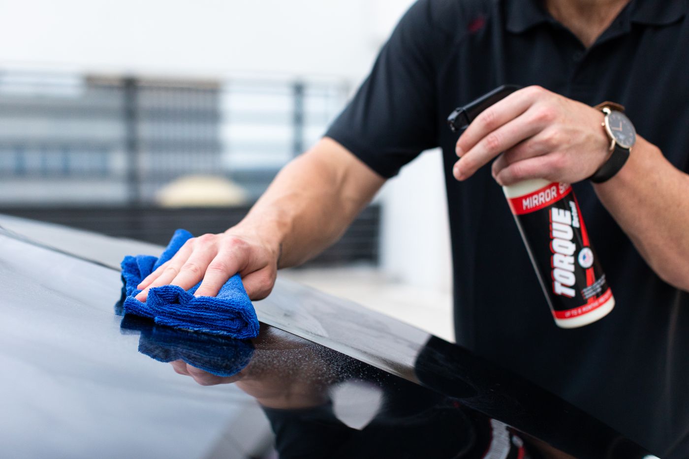 A Royal Shine detailer hand-polishing a luxury car at the Margate studio