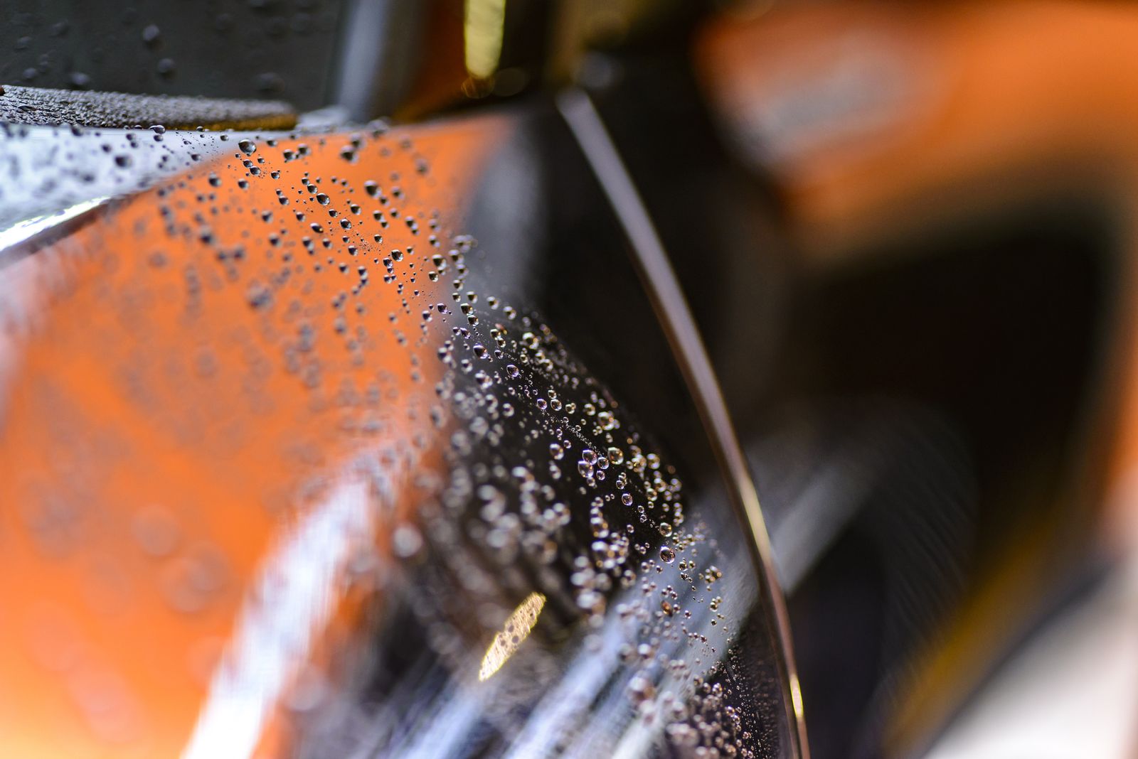 Water beading on a ceramic-coated car